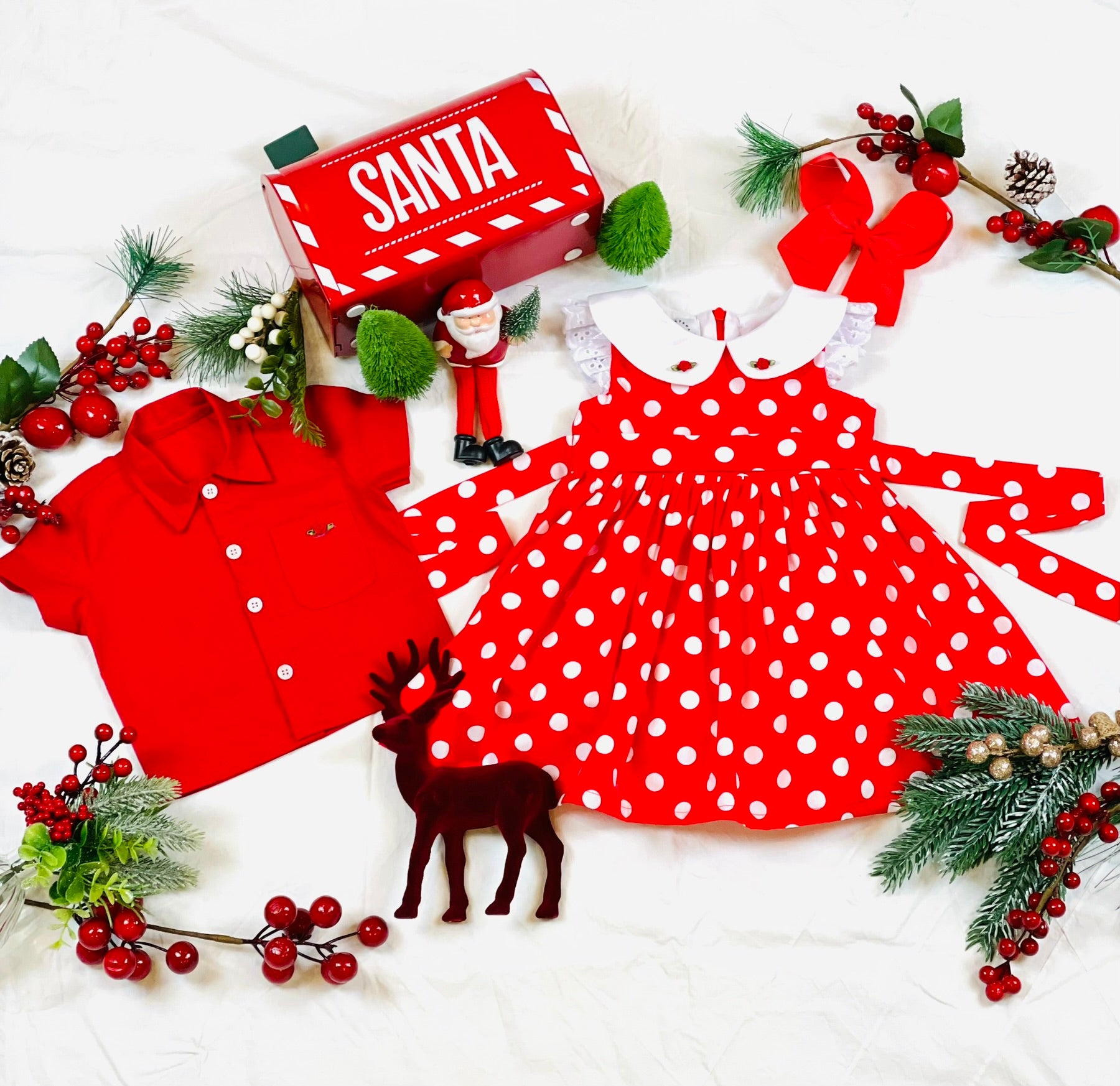 Red and white polka dot dress with white lace gathered frill sleeves and white collar with two red satin rose buds and  rear bow stash. Matching the dress is the red Joy Boys Shirt red in colour with contrasting white buttons and a red satin rose bud on the pocket. 